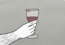 Cropped Image Of Man Holding Wineglass With Lipstick Kiss Against Gray Background