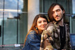 © shurkin_son - Love and friendship concept. Stylish beautiful young woman wearing jeans jacket embracing her fashionable bearded boyfriend in camouflage bomber, cuddling, enjoyig sweet moments of happiness