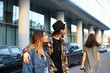 © shurkin_son - Stylish unfaithful young male hugging his fashionable girlfriend and gazing after another girl who just walked by them. People, relationships, romance, love triangle, jealousy and infidelity concept