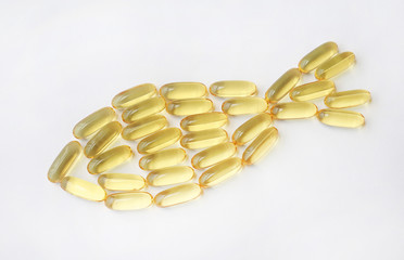 fish oil capsules on a white background.