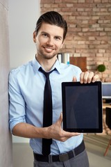 Canvas Print - Happy businessman holding tablet