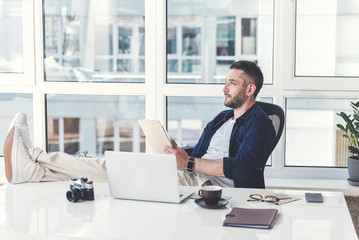 Wall Mural - Pensive stylish guy is thinking about future