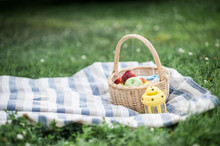 Basket With Apples On The Grass. Picnic. Summer. Fruits. Nature.