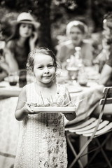 Poster -  Multi-generation family having lunch in the garden