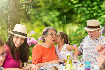 Sticker - Three generations family having lunch in the garden