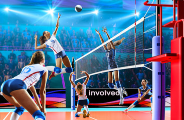 Wall Mural - Female professional volleyball players in action on grand court