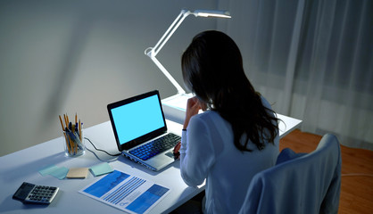 Canvas Print - businesswoman with laptop at night office