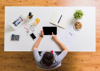 Sticker - woman with tablet pc and notebook at office table