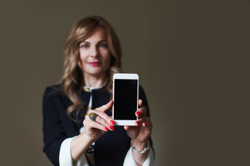 Woman shows her mobile phone screen