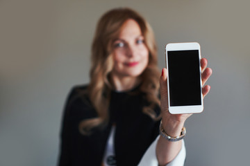 Woman shows her mobile phone screen