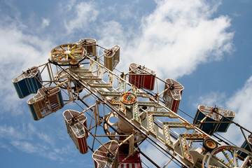 Fair carnival ride against blue sky.