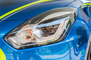 Close up of a blue and yellow sport car