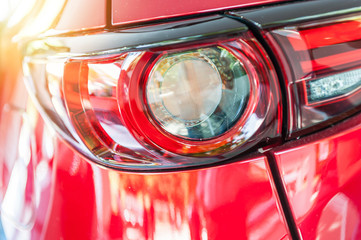 Wall Mural - Close up of a red sport car in sunset