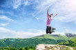 © nickolya - Young woman jumping in the mountains