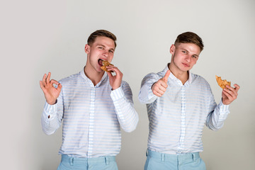 Men eating buns on grey background