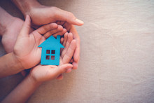 Hands Holding Paper House, Family Home, Homeless Shelter, International Day Of Families, Foster Home Care, Family Day Care, Social Distancing, Stay At Home, Mortgage Housing Crisis  Concept