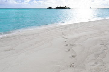 Sticker - Human footprints on beach sand at resort