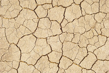 Barren Earth. Dry Cracked Earth Background. Cracked Mud Pattern. Soil In Cracks.Creviced Texture.Drought Land. Environment Drought