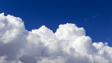 A Big And Fluffy Cumulonimbus Cloud In The Blue Sky