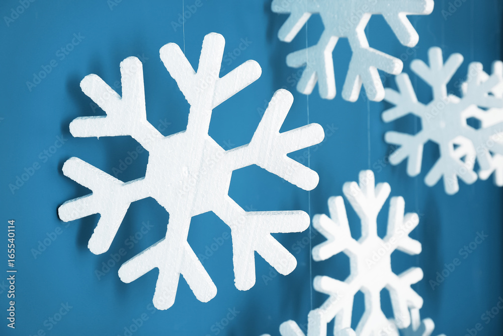 Set of snowflakes as Christmas decorations on color background