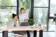 © LIGHTFIELD STUDIOS - multiethnic businesswomen discussing new business project while sitting at workplace in office