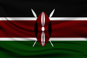 Sticker - National flag of Kenya on wavy fabric with a volumetric pattern of hexagons. Vector illustration.