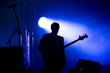 © salajean - Silhouette of a guitar player on the stage
