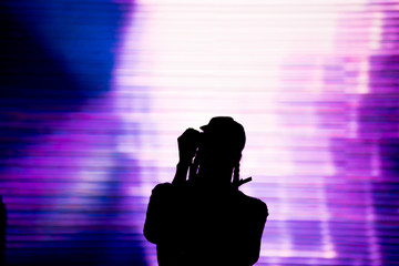 Sticker - Silhouette of an artist singing live on the stage