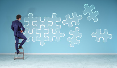Poster - Businessman searching puzzle solution on a wall 3D rendering