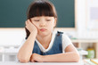 © View Stock - Portrait of a girl sitting in classroom
