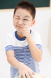 © View Stock - School boy using magnifying Glass