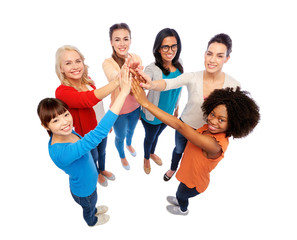 Wall Mural - international group of happy women doing high five