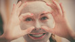© Voyagerix - Woman with clay mud mask having fun