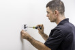 © spatesphoto - Hvac Tech Installing Thermostat