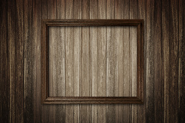 Wall Mural - Picture frame on dark wooden wall