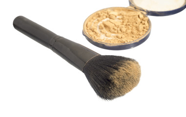 Make up powder and a brush on white background