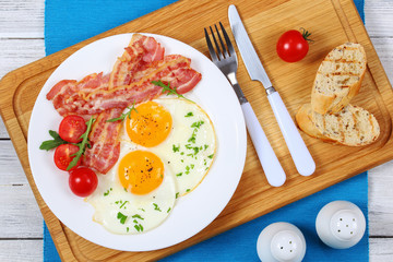 Sticker - crispy fried bacon and eggs on plate