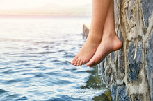  Wet Bare Girl's Feet Dangling From The Jetty 