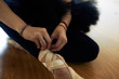 © DragonImages - Ballerina Tying Pointe Shoes