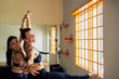 © DragonImages - Pretty Woman Participating in Dance Class