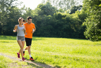 Wall Mural - Happy couple running and jogging together