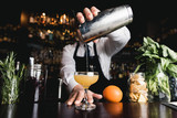Bartender pouring cocktail