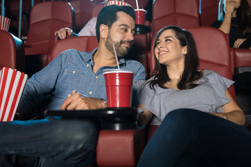 Couple enjoying their date at the movies