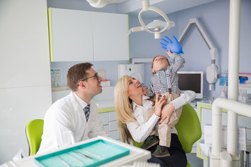 Wall Mural - .Friendly dentistry works with a child in a clinic