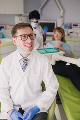 Wall Mural - Portrait of an expert dentist in glasses