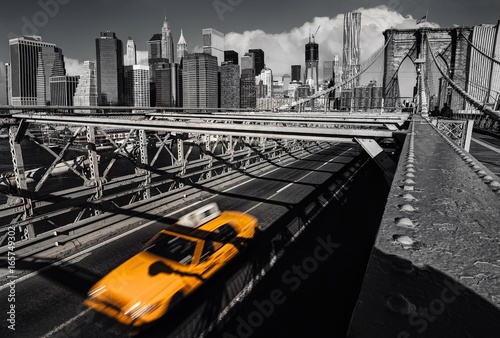 a-yellow-cab-on-the-brooklyn-bridge