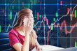 © joyfotoliakid - Asian businesswoman sitting on working space and looking the Stock market exchange information and Trading graph