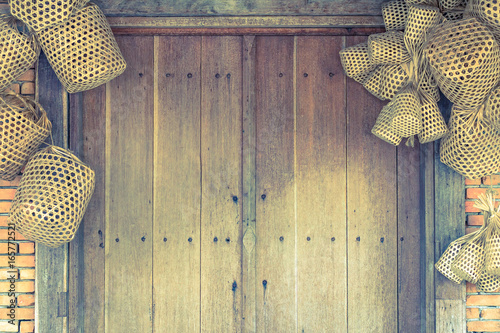Wooden Door And Brick Wall Background With Basket Weave Wood