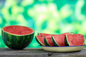 Sliced watermelon on a wooden table