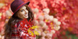 © ZoomTeam - Portrait of an autumn woman over red and golden leaves